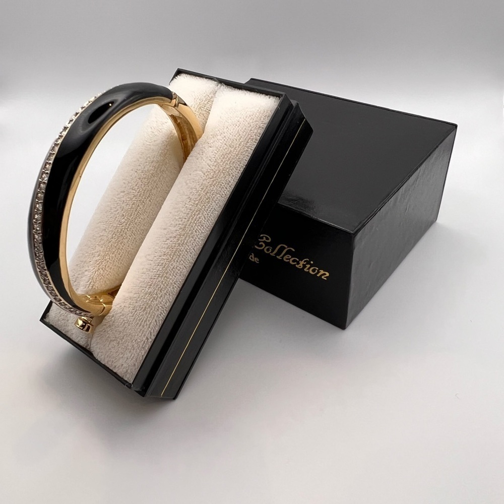 Beautiful bangle with stones and black enamel.